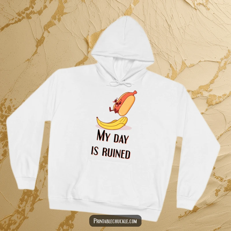 Funny hooded sweatshirt depicting a surprised banana peel sliding under the feet of a walking hot dog, a comedic scene.