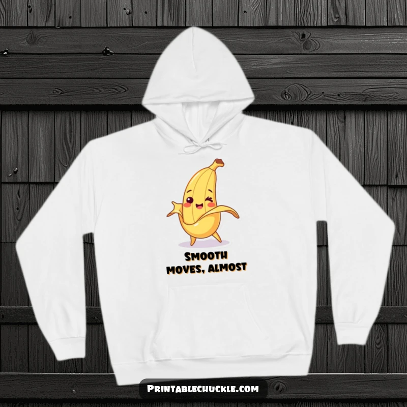 Funny hoodie featuring a smiling banana character comically tripping over its own peel, embodying cheerful misfortune.