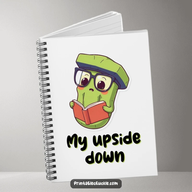 Funny Notebook with a proud pickle wearing oversized spectacles and reading a book upside down, ideal for jotting notes.